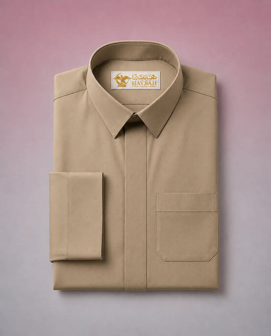 Folded Desert Beige Classic Thobe showcasing premium craftsmanship, elegant shirt collar, concealed placket, chest pocket detail, and breathable fabric. Luxury Saudi thobe, premium jubba, men's Islamic clothing, ثوب سعودي فاخر, ثوب بيج صحراوي, ثوب بيج رجالي, ثوب عربي أنيق, جلابية رجالية فاخرة, دشداشة رجالية راقية, premium Arab menswear suitable for daily wear, prayer, Ramadan gatherings, Eid occasions, and timeless sophistication.