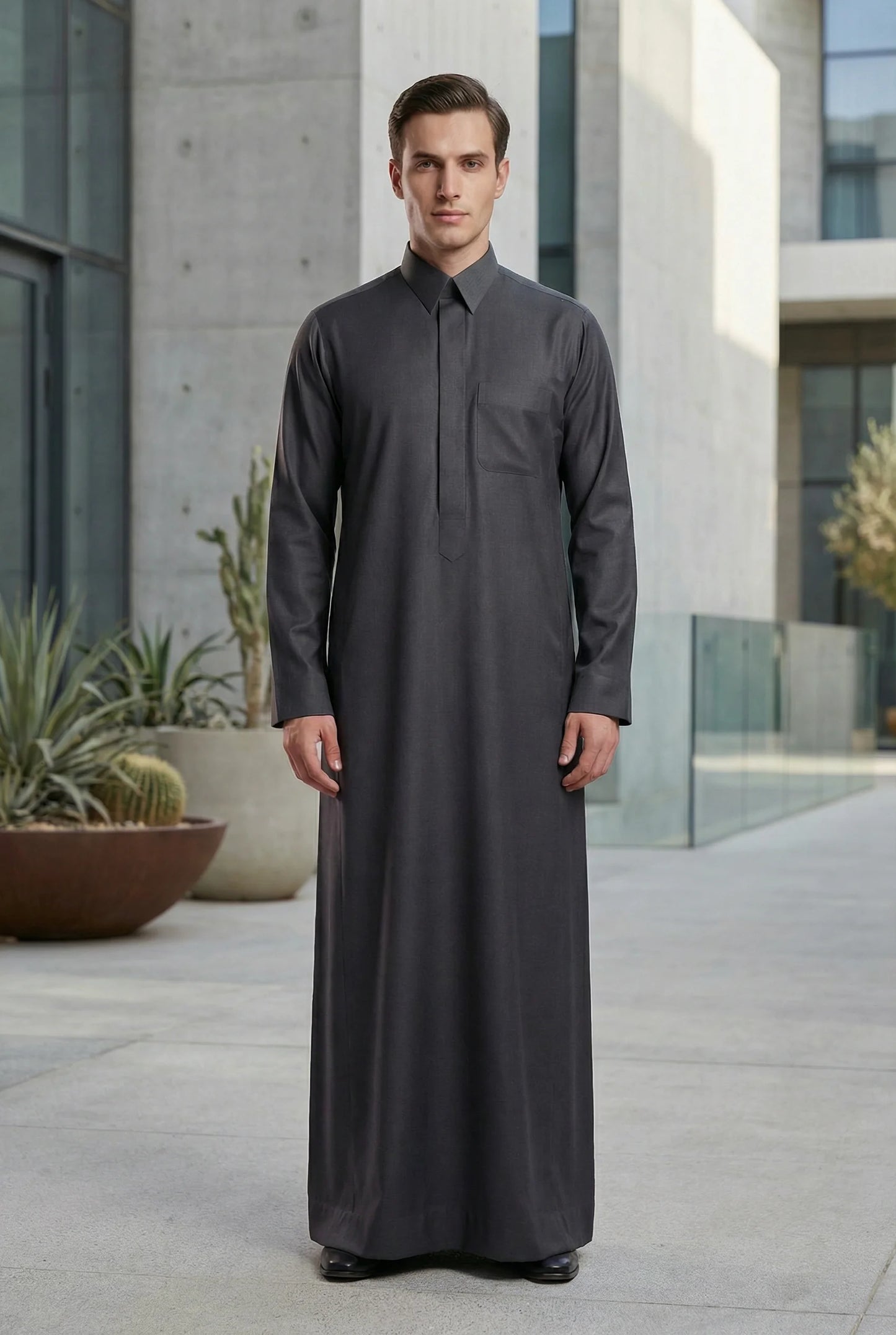 Charcoal Grey Signature Executive Saudi Thobe styled in a contemporary luxury setting, showcasing premium Islamic menswear with modern tailoring and timeless Arab elegance. Luxury Saudi thobe, men's designer thobe, premium jubba, ثوب سعودي فاخر للرجال, ثوب رجالي أنيق, جلابية رجالية فخمة, دشداشة رجالية راقية, ملابس إسلامية رجالية, modest fashion for professionals seeking refined style for Ramadan, Eid, formal occasions, business events, and distinguished everyday wear.