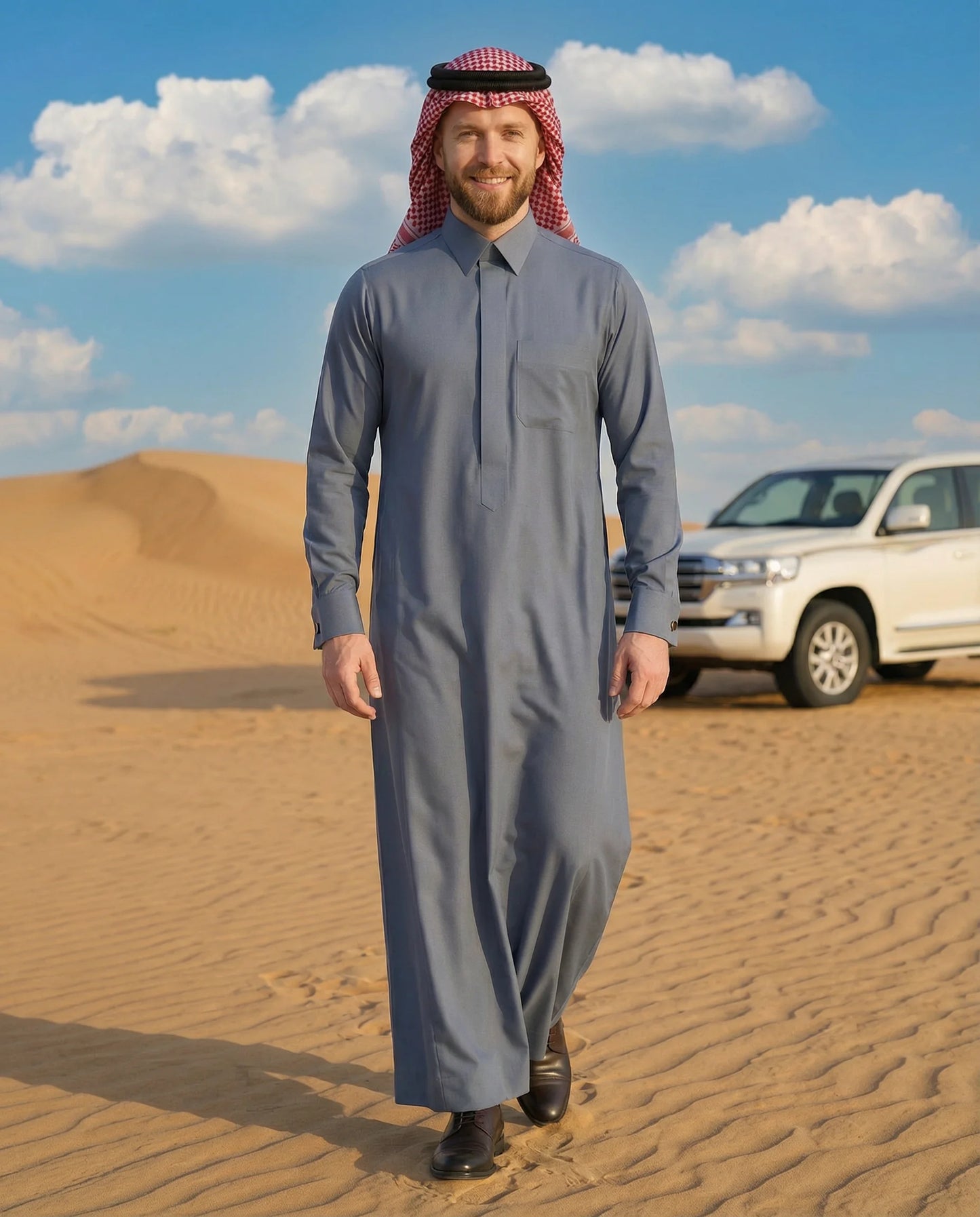 Slate Blue Luxury Thobe styled in an authentic Gulf desert setting, showcasing premium craftsmanship, timeless elegance, modern Arab fashion, and refined sophistication. Designed for weddings, Eid gatherings, family celebrations, formal occasions, and gentlemen who appreciate luxury Islamic clothing and distinguished Gulf style. ثوب أزرق رمادي فاخر بإطلالة صحراوية خليجية راقية يجمع بين الفخامة والأناقة العصرية للمناسبات الرسمية والاحتفالات المميزة.slate blue thobe, luxury thobe, premium saudi thobe, gulf th