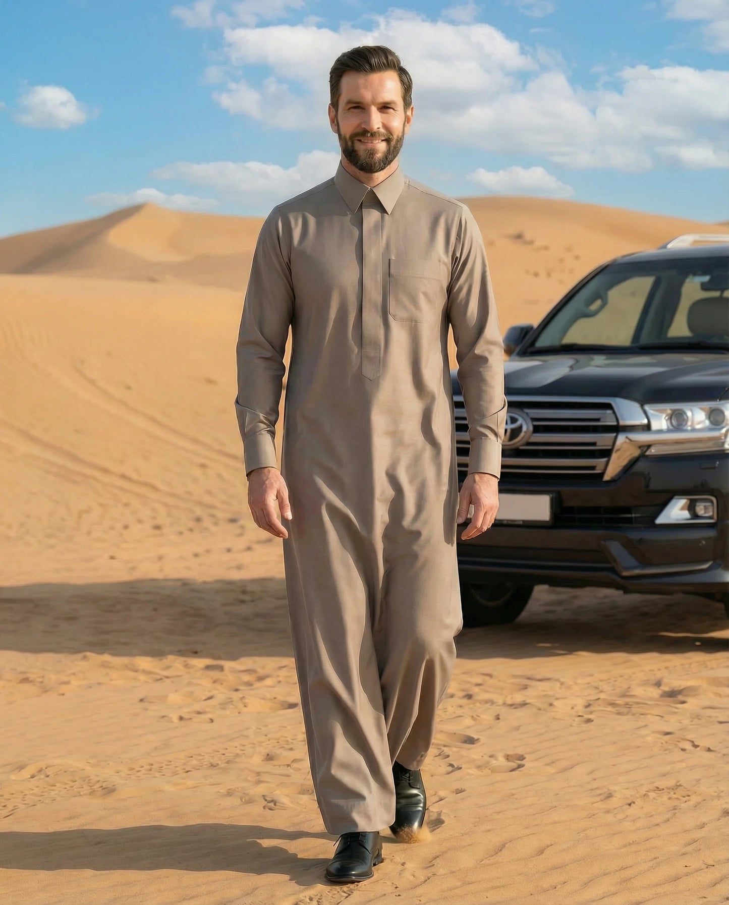 Luxury Warm Grey Premium Formal Thobe by Haybah styled in an authentic desert lifestyle setting, combining premium craftsmanship, breathable comfort, elegant tailoring, and timeless Gulf fashion inspired by tradition and modern sophistication. ثوب رمادي دافئ فاخر بإطلالة صحراوية أصيلة يجمع بين الفخامة والراحة والأناقة الخليجية العصرية ليمنح الرجل حضوراً مميزاً في جميع المناسبات.