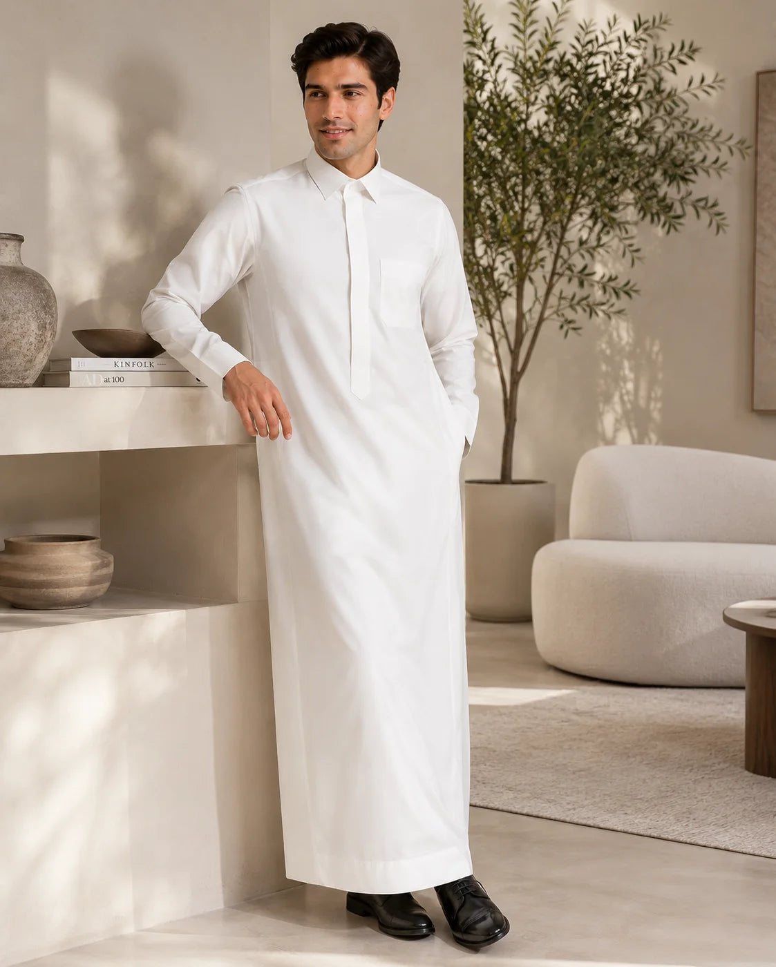 Elegant Saudi thobe lifestyle photography featuring premium white fabric, sophisticated design and modern living environment