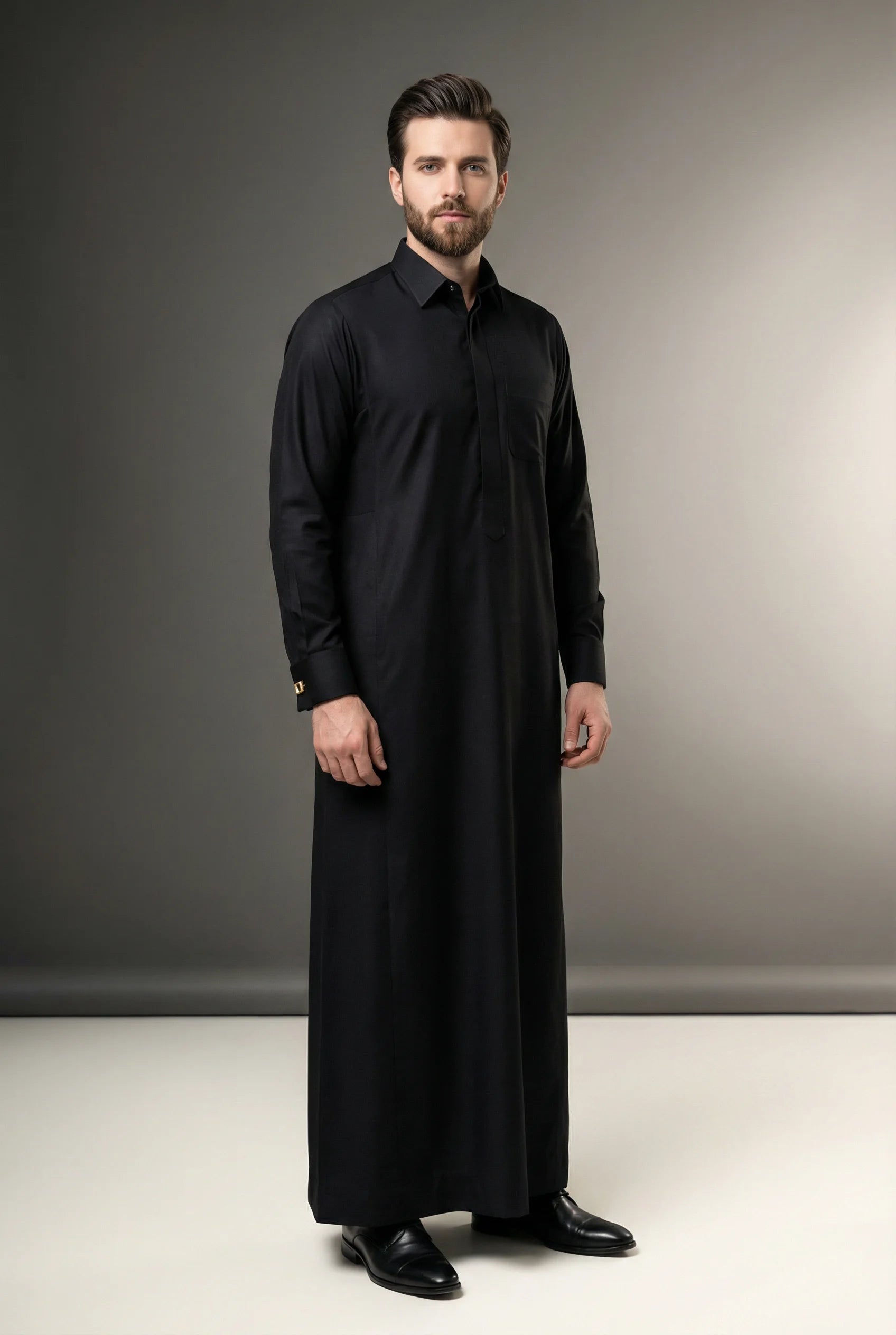 Deep Black Luxury Thobe – Royal Occasion Collection by Haybah featuring an elegant deep black color, concealed front placket, structured turn-down collar, premium breathable fabric, refined executive tailoring, and timeless Gulf sophistication designed for weddings, nikah ceremonies, Eid celebrations, formal gatherings, luxury events, and distinguished gentlemen seeking prestige and confidence. ثوب أسود فاخر بتصميم راقٍ يجمع بين الفخامة الخليجية والأناقة الملكية للمناسبات الرسمية والاحتفالات الراقية.