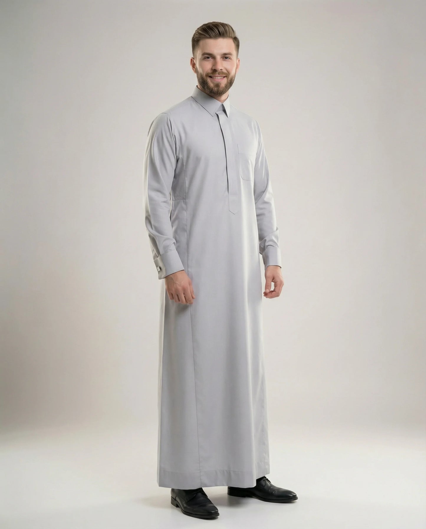 Light Grey Luxury Thobe – Executive Occasion by Haybah featuring a sophisticated light grey tone, concealed front placket, structured collar, premium luxury fabric, elegant tailoring, and refined Gulf craftsmanship. Designed for business professionals, formal gatherings, executive events, Eid celebrations, nikah ceremonies, and modern gentlemen seeking prestige, confidence, and timeless elegance. ثوب رمادي فاتح فاخر من مجموعة Executive Occasion يجمع بين الأناقة الخليجية الراقية والتفصيل الفاخر للمناسبات الر