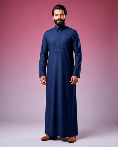 Midnight Blue Classic Thobe Refined Everyday Elegance for men featuring premium tailoring, structured turn-down collar, concealed front placket, breathable luxury fabric, and sophisticated midnight blue finish. Luxury Saudi thobe, men's thobe, Islamic clothing, Arabic menswear, ثوب رجالي, ثوب سعودي, ثوب أزرق كحلي, ثوب رجالي فاخر, جلابية رجالية أنيقة, دشداشة رجالية, ثوب رسمي للرجال, premium modest fashion designed for work, prayer, Eid celebrations, Ramadan gatherings, family occasions, and modern everyday e
