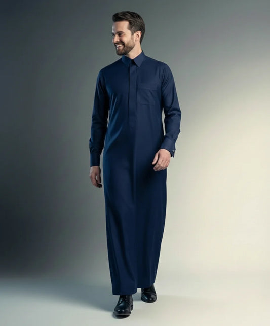 Navy Blue Premium Formal Thobe – Timeless Formal Fit by Haybah featuring a rich navy blue tone, concealed front placket, structured turn-down collar, premium breathable fabric, and refined tailoring designed for business meetings, formal occasions, Eid gatherings, Jumuah prayers, and modern professional wear. ثوب أزرق كحلي فاخر بتصميم رسمي أنيق وقصة متقنة يمنح الرجل مظهراً راقياً وحضوراً مميزاً في المناسبات الرسمية واليومية.