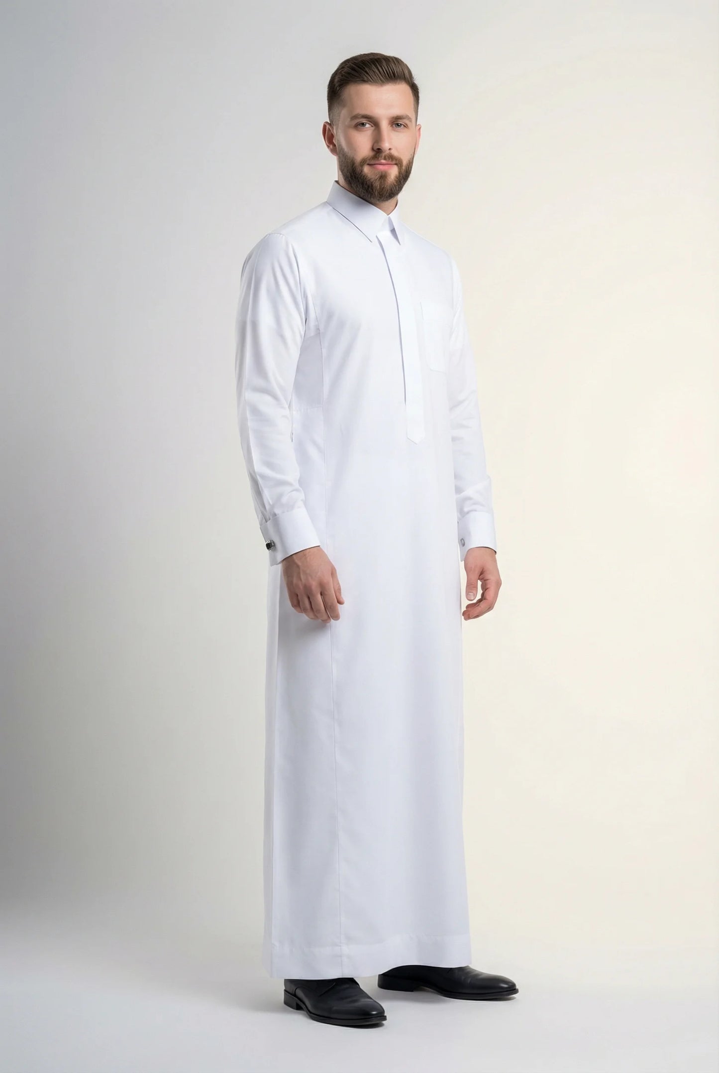 Pure White Premium Thobe – Formal Precision by Haybah featuring refined executive tailoring, structured turn-down collar, concealed placket, premium breathable fabric, and elegant formal styling for business meetings, weddings, Eid celebrations, and distinguished occasions. ثوب أبيض فاخر بتصميم رسمي أنيق وخياطة متقنة وقماش عالي الجودة يمنح مظهراً راقياً ومميزاً للرجل العصري.