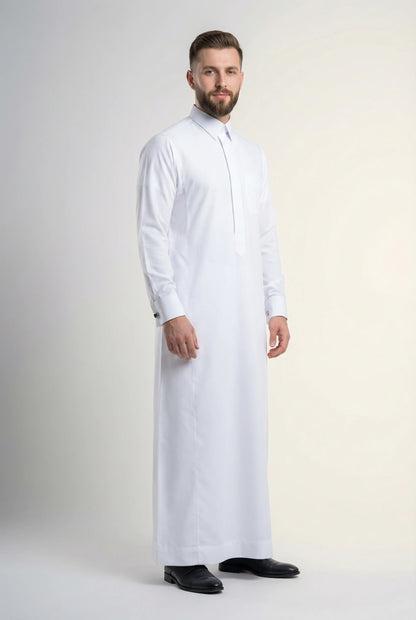 Pure White Premium Thobe – Formal Precision by Haybah featuring refined executive tailoring, structured turn-down collar, concealed placket, premium breathable fabric, and elegant formal styling for business meetings, weddings, Eid celebrations, and distinguished occasions. ثوب أبيض فاخر بتصميم رسمي أنيق وخياطة متقنة وقماش عالي الجودة يمنح مظهراً راقياً ومميزاً للرجل العصري.
