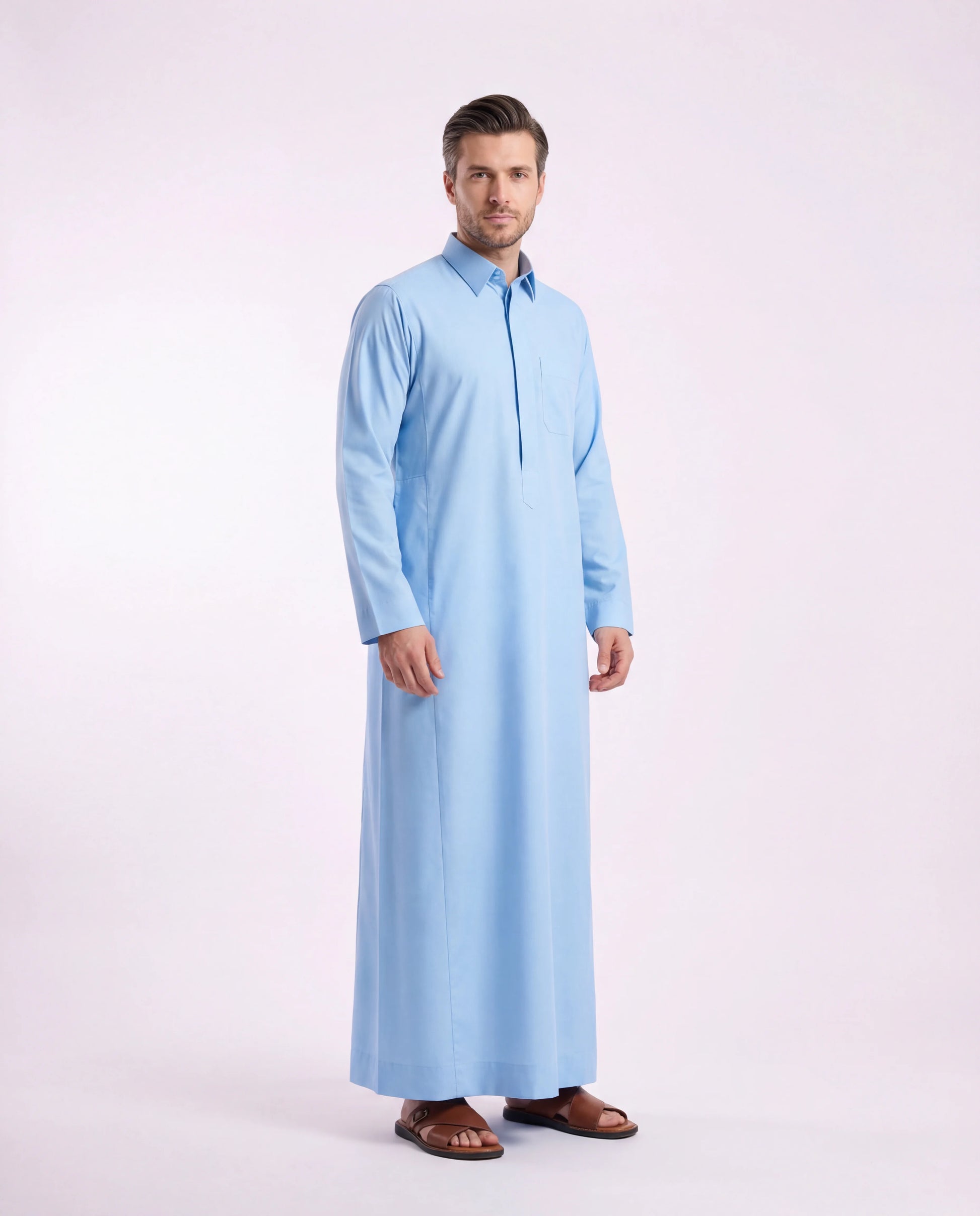 Sky Blue Classic Thobe Clean Everyday Silhouette for men featuring a premium turn-down collar, concealed front placket, breathable lightweight fabric, and elegant sky blue finish. Luxury Saudi thobe, men's thobe, Islamic clothing, Arabic menswear, ثوب رجالي, ثوب سعودي, ثوب أزرق سماوي, ثوب رجالي فاخر, جلابية رجالية أنيقة, دشداشة رجالية, ثوب رسمي للرجال, premium modest fashion ideal for daily wear, office settings, Eid celebrations, Ramadan gatherings, Friday prayer, and sophisticated modern lifestyles across
