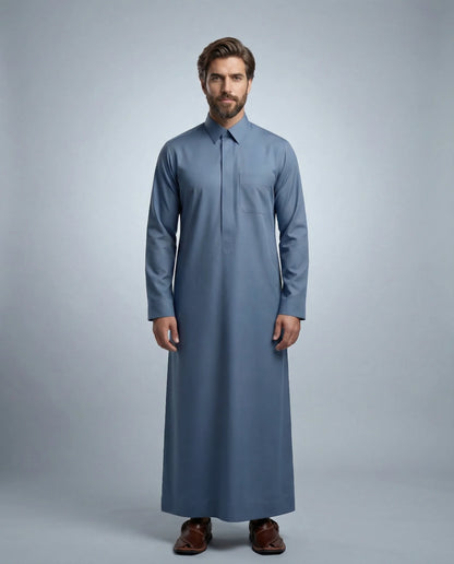 Steel Blue Classic Thobe Modern Everyday Confidence for men featuring premium tailoring, structured turn-down collar, concealed front placket, breathable luxury fabric, and refined steel blue finish. Luxury Saudi thobe, men's thobe, Islamic clothing, Arabic menswear, ثوب رجالي, ثوب سعودي, ثوب أزرق فولاذي, ثوب رجالي فاخر, جلابية رجالية أنيقة, دشداشة رجالية, ثوب رسمي للرجال, premium modest fashion designed for daily wear, business settings, Eid celebrations, Ramadan gatherings, Friday prayer, and sophisticate