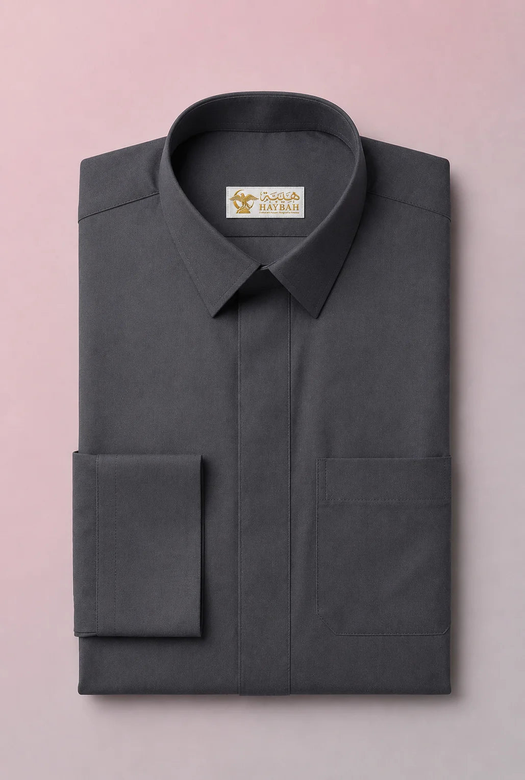 Folded Charcoal Grey Signature Saudi Thobe showcasing luxury craftsmanship, structured collar, concealed button placket, refined stitching, and premium breathable fabric. Executive men's thobe, Saudi jubba, traditional Arab clothing, ثوب سعودي فاخر, ثوب رجالي كلاسيكي, جلابية رجالية فاخرة, دشداشة رجالية أنيقة, premium Islamic wear for formal occasions, mosque visits, Eid, and professional environments.
