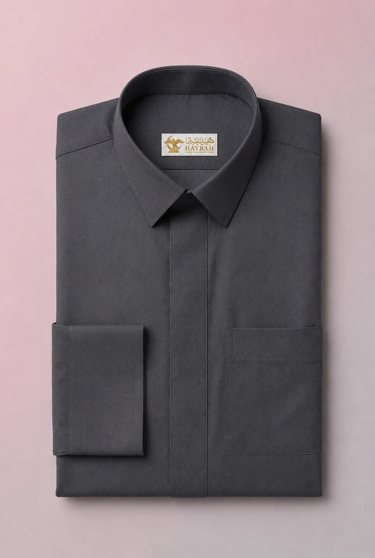 Folded Charcoal Grey Signature Saudi Thobe showcasing luxury craftsmanship, structured collar, concealed button placket, refined stitching, and premium breathable fabric. Executive men's thobe, Saudi jubba, traditional Arab clothing, ثوب سعودي فاخر, ثوب رجالي كلاسيكي, جلابية رجالية فاخرة, دشداشة رجالية أنيقة, premium Islamic wear for formal occasions, mosque visits, Eid, and professional environments.