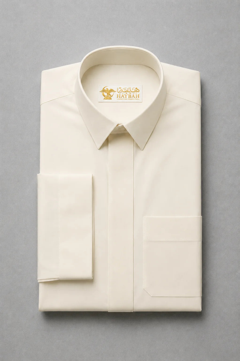 Folded Cream White Signature thobe showcasing premium fabric quality, structured turn down collar and clean craftsmanship for modern men's wear