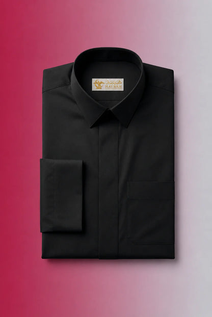 Folded Deep Black Classic Thobe showcasing luxury craftsmanship, concealed placket, structured collar, chest pocket detail, and premium breathable fabric. Luxury Saudi thobe, men's premium jubba, Islamic clothing for men, ثوب أسود رجالي فاخر, ثوب سعودي راقٍ, جلابية رجالية أنيقة, دشداشة رجالية فخمة, premium Arab menswear suitable for prayer, Eid, Ramadan, and daily sophistication.
