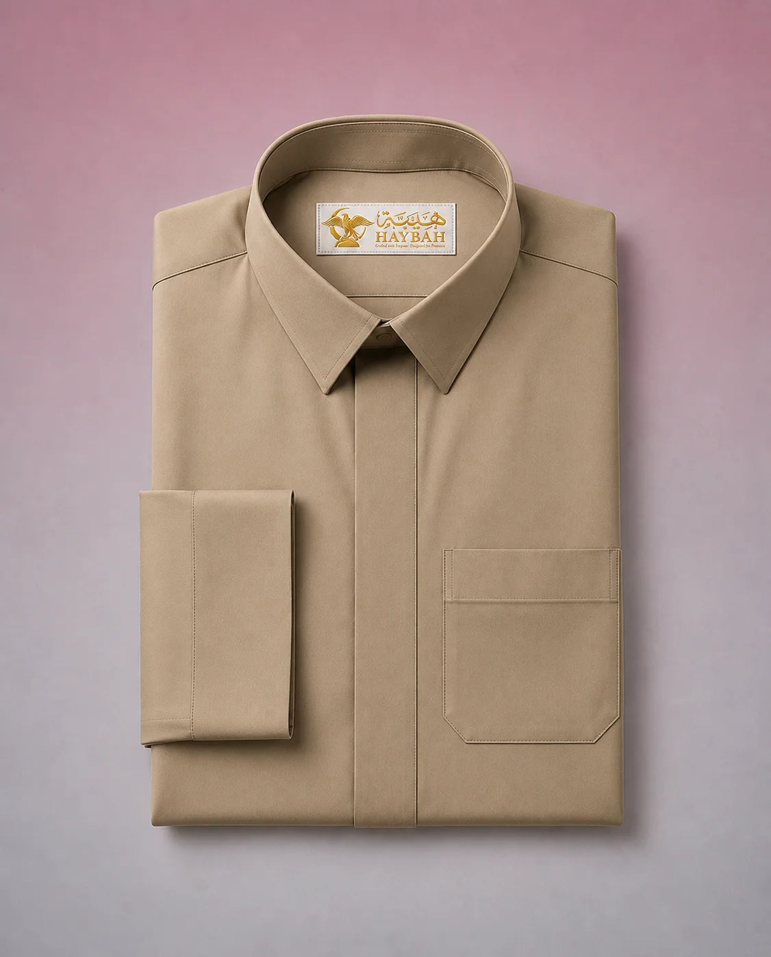 Folded Desert Beige Classic Thobe showcasing premium craftsmanship, elegant shirt collar, concealed placket, chest pocket detail, and breathable fabric. Luxury Saudi thobe, premium jubba, men's Islamic clothing, ثوب سعودي فاخر, ثوب بيج صحراوي, ثوب بيج رجالي, ثوب عربي أنيق, جلابية رجالية فاخرة, دشداشة رجالية راقية, premium Arab menswear suitable for daily wear, prayer, Ramadan gatherings, Eid occasions, and timeless sophistication.