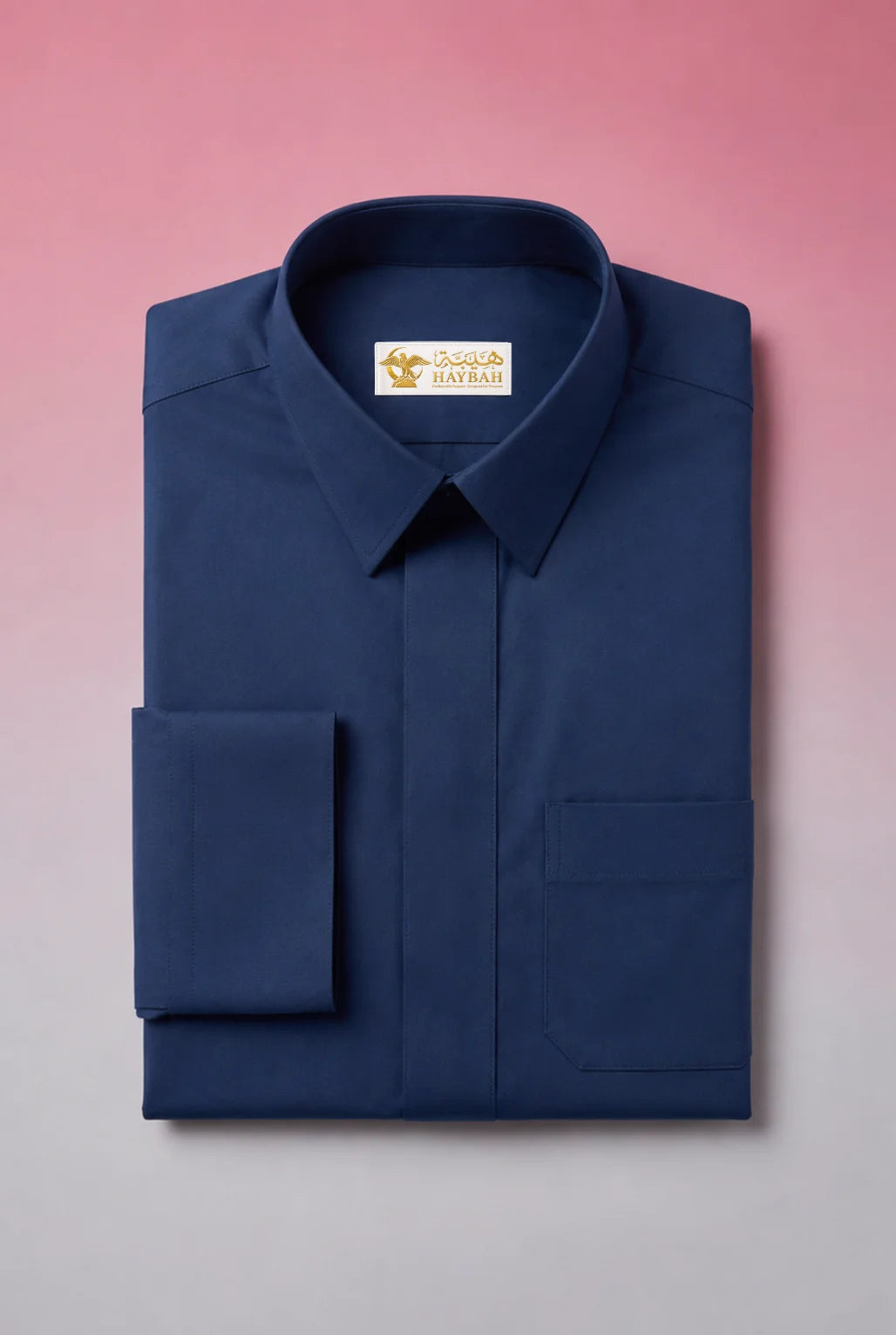 Folded Midnight Blue Classic Thobe showcasing premium craftsmanship, elegant turn-down collar, concealed placket, chest pocket detail, and smooth breathable fabric. Luxury Saudi thobe, premium jubba, men's Islamic clothing, ثوب سعودي فاخر, ثوب أزرق كحلي رجالي, جلابية رجالية فاخرة, دشداشة رجالية أنيقة, ثوب يومي راقي, refined Arab menswear suitable for work, prayer, Eid occasions, Ramadan evenings, formal gatherings, and elevated everyday style.