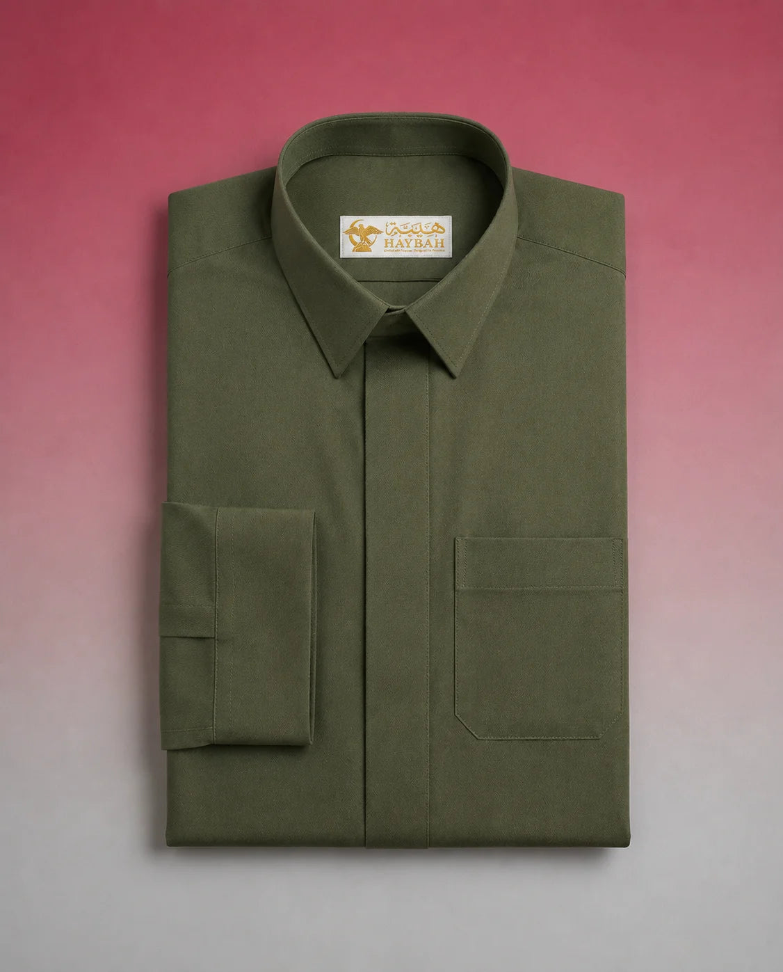Folded Olive Green Premium Thobe showcasing premium craftsmanship, elegant shirt collar, concealed placket, chest pocket detail, and breathable fabric. Luxury Saudi thobe, premium jubba, men's Islamic clothing, ثوب سعودي فاخر, ثوب أخضر زيتوني, ثوب زيتي رجالي, ثوب عربي أنيق, جلابية رجالية فاخرة, دشداشة رجالية راقية, premium Arab menswear designed for daily wear, prayer, Ramadan gatherings, Eid occasions, and timeless sophistication.