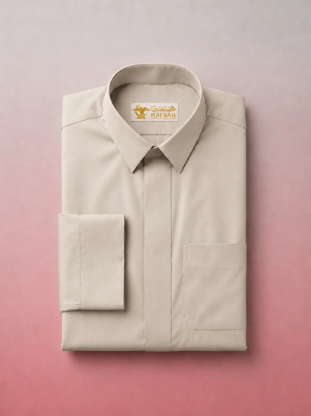 Folded Pearl Beige Classic Thobe showcasing premium craftsmanship, elegant shirt collar, concealed placket, chest pocket detail, and breathable fabric. Luxury Saudi thobe, premium jubba, men's Islamic clothing, ثوب سعودي فاخر, ثوب بيج لؤلؤي, ثوب بيج فاتح رجالي, ثوب عربي أنيق, جلابية رجالية فاخرة, دشداشة رجالية راقية, premium Arab menswear designed for daily wear, prayer, Ramadan gatherings, Eid occasions, and timeless sophistication.