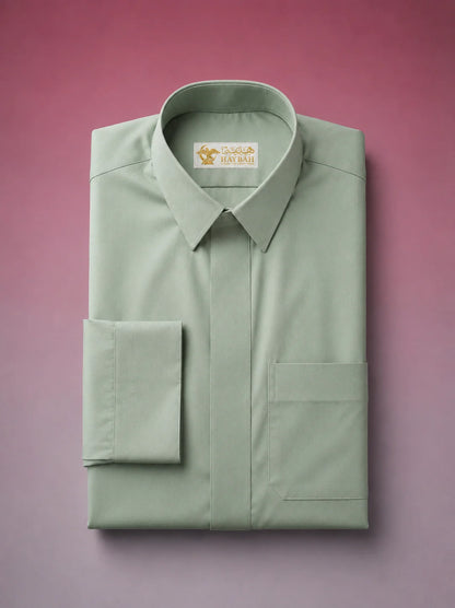 Folded Sage Green Classic Thobe showcasing premium craftsmanship, concealed placket, elegant shirt collar, chest pocket detail, and breathable luxury fabric. Premium Saudi thobe, luxury jubba, men's Islamic clothing, ثوب أخضر سيج, ثوب سعودي فاخر, ثوب أخضر فاتح رجالي, ثوب عربي أنيق, جلابية رجالية فاخرة, دشداشة رجالية راقية, premium Arab menswear designed for daily wear, prayer, Ramadan, Eid, and formal occasions.