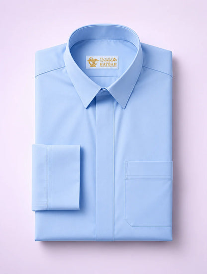 Folded Sky Blue Classic Thobe showcasing premium tailoring, structured collar, concealed placket, chest pocket detail, and smooth breathable fabric. Luxury Saudi thobe, premium jubba, men's Islamic clothing, ثوب سعودي فاخر, ثوب أزرق رجالي, جلابية رجالية فاخرة, دشداشة رجالية أنيقة, ثوب يومي راقي, elegant Arab menswear designed for comfort, professionalism, prayer, family gatherings, Eid occasions, and refined everyday style.