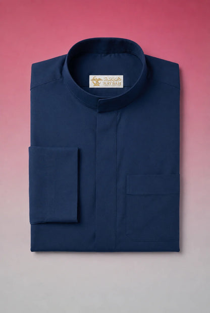 Folded Slate Blue Classic Thobe showcasing premium craftsmanship, elegant band collar, concealed placket, chest pocket detail, and breathable fabric. Luxury Saudi thobe, premium jubba, men's Islamic clothing, ثوب سعودي فاخر, ثوب أزرق أردوازي رجالي, ثوب كحلي فاخر, جلابية رجالية أنيقة, دشداشة رجالية راقية, ثوب يومي فاخر, premium Arab menswear suitable for work, prayer, Ramadan gatherings, Eid occasions, and refined everyday elegance.