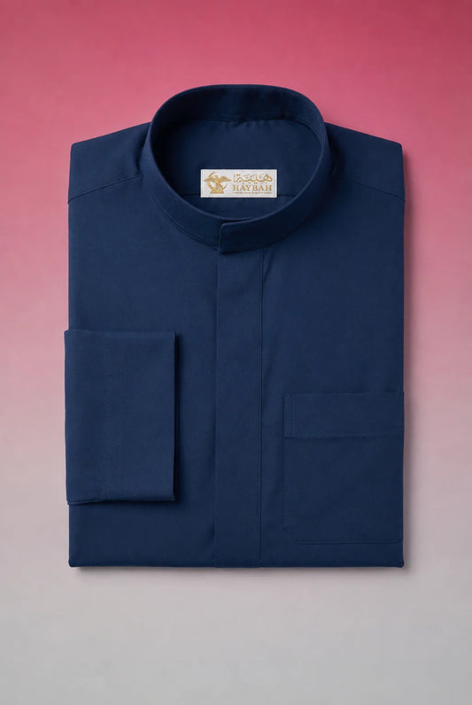Folded Slate Blue Classic Thobe showcasing premium craftsmanship, elegant band collar, concealed placket, chest pocket detail, and breathable fabric. Luxury Saudi thobe, premium jubba, men's Islamic clothing, ثوب سعودي فاخر, ثوب أزرق أردوازي رجالي, ثوب كحلي فاخر, جلابية رجالية أنيقة, دشداشة رجالية راقية, ثوب يومي فاخر, premium Arab menswear suitable for work, prayer, Ramadan gatherings, Eid occasions, and refined everyday elegance.