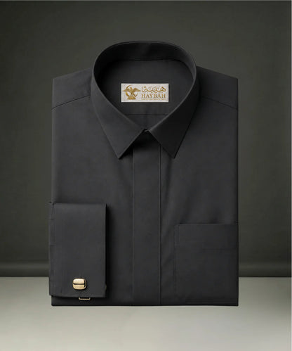 Folded Smoke Black Executive Thobe showcasing premium craftsmanship, luxury smoke black fabric, concealed placket, structured collar, elegant stitching, sophisticated finishing, and refined Gulf formalwear tailoring by Haybah. ثوب أسود دخاني فاخر مطوي بعناية يبرز جودة القماش والخياطة الدقيقة والتصميم الأنيق المناسب للمناسبات الرسمية والاحتفالات الراقية.