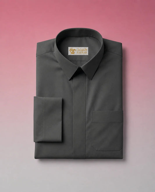 Folded Smoke Black Classic Thobe showcasing premium craftsmanship, concealed placket, elegant shirt collar, chest pocket detail, and breathable luxury fabric. Premium Saudi thobe, luxury jubba, men's Islamic clothing, ثوب أسود فاخر, ثوب فحمي رجالي, ثوب سعودي راقٍ, ثوب عربي أنيق, جلابية رجالية فخمة, دشداشة رجالية فاخرة, premium Arab menswear designed for daily wear, prayer, Ramadan, Eid, and formal occasions.