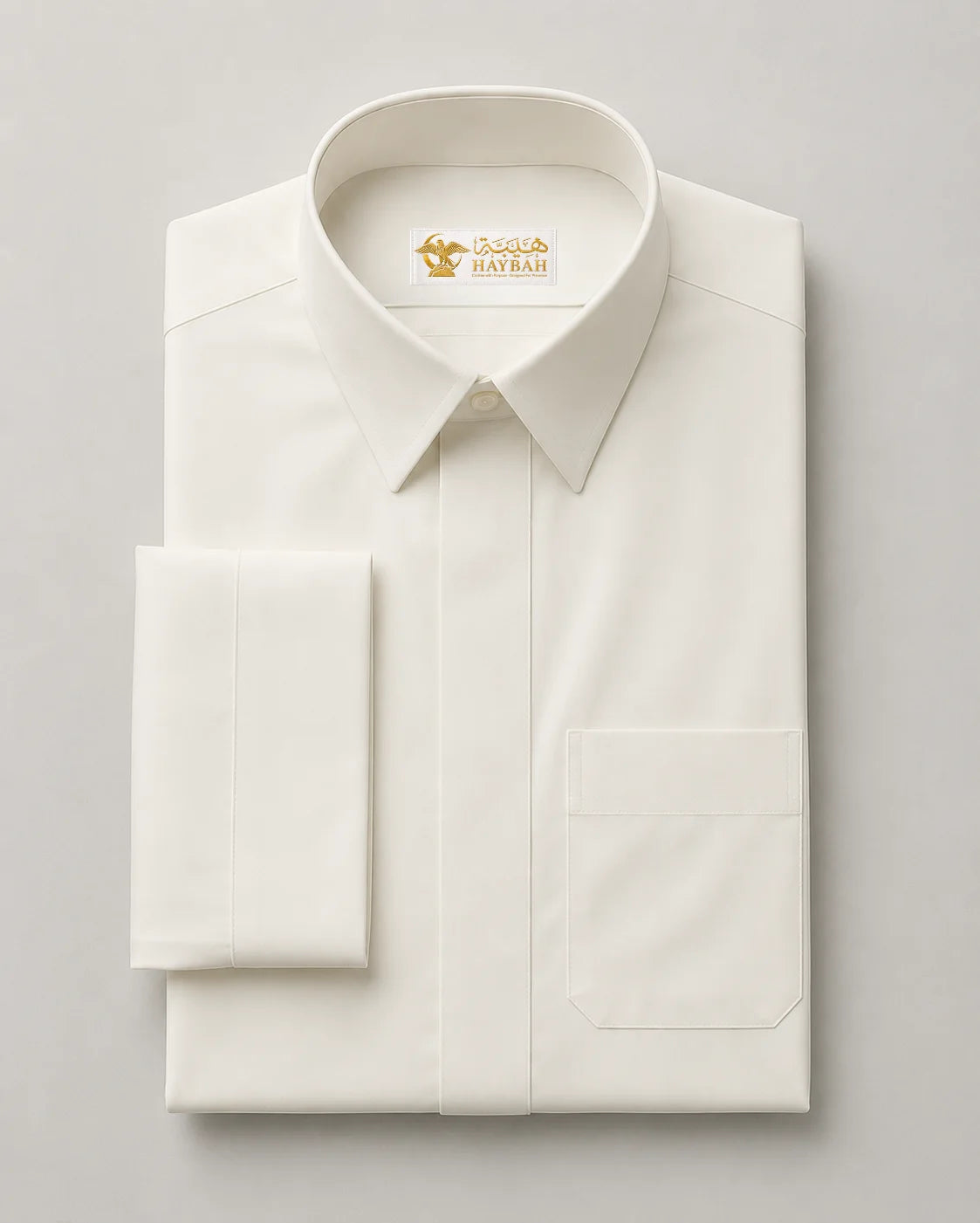 Premium white Saudi thobe neatly folded displaying luxury fabric quality, collar detail and elegant tailoring