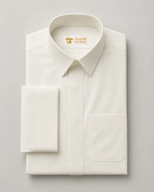 Premium white Saudi thobe neatly folded displaying luxury fabric quality, collar detail and elegant tailoring