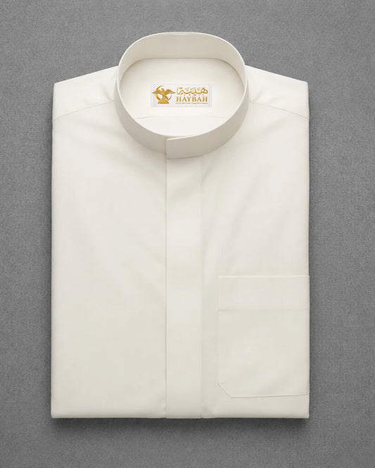 Folded Off White Classic Thobe showcasing premium fabric, Mandarin collar design and clean craftsmanship for modern Saudi men's wear
