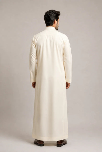 Back view of Cream White Signature Saudi thobe for men highlighting a tailored silhouette, long sleeves and sophisticated traditional design