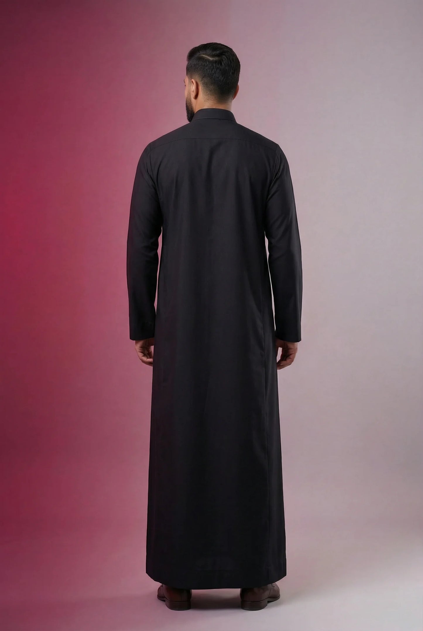 Back view of Deep Black Classic Thobe highlighting clean tailoring, elegant drape, premium construction, and timeless Saudi craftsmanship. Luxury black thobe, Saudi jubba, Arabic menswear, ثوب أسود فاخر, ثوب سعودي كلاسيكي, ثوب رجالي رسمي, جلابية رجالية فاخرة, دشداشة رجالية أنيقة, premium Islamic clothing for formal events, work, prayer, Ramadan, and Eid celebrations.