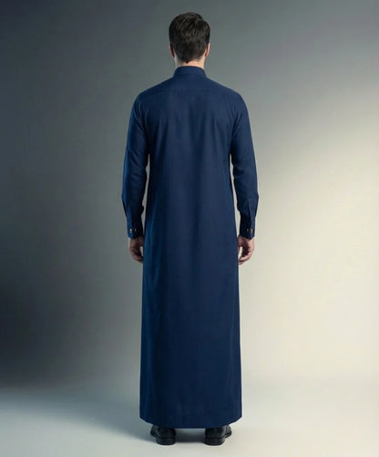 Back view of Navy Blue Premium Formal Thobe highlighting a clean tailored silhouette, elegant drape, premium fabric construction, and timeless formal menswear styling for modern gentlemen. منظر خلفي لثوب أزرق كحلي فاخر يظهر القصة المتناسقة والانسيابية الأنيقة والخياطة الاحترافية لمظهر راقٍ ومتميز.