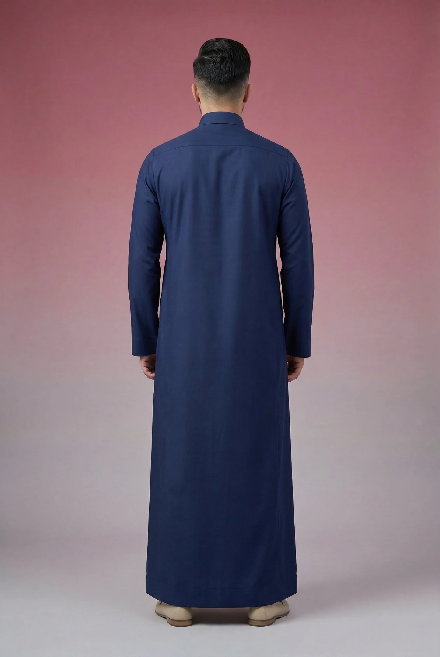 Back view of Navy Blue Classic Thobe highlighting clean tailoring, premium fabric drape, modest full-length silhouette, and elegant contemporary construction. Men's Saudi thobe, luxury Arabic clothing, premium jubba, ثوب رجالي سعودي, ثوب أزرق بحري فاخر, ثوب رسمي رجالي, جلابية رجالية طويلة, ملابس إسلامية رجالية فاخرة, modern modest fashion combining comfort, sophistication, and timeless Middle Eastern elegance.
