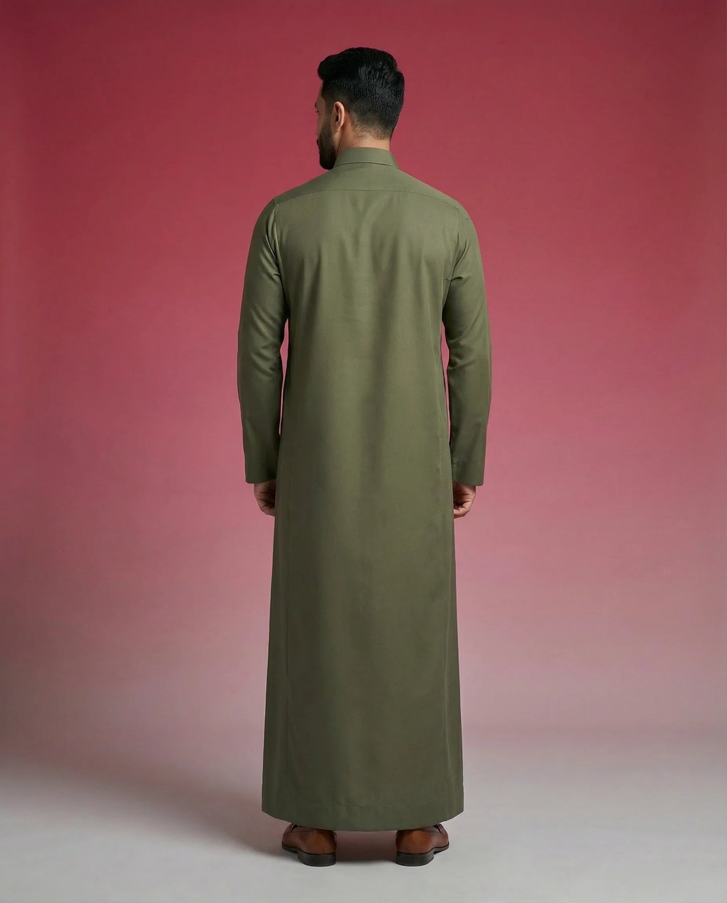 Back view of Olive Green Premium Thobe highlighting clean tailoring, premium construction, elegant drape, and refined Saudi-inspired craftsmanship. Luxury men's thobe, Saudi jubba, Arabic menswear, ثوب سعودي أنيق, ثوب رجالي فاخر, ثوب أخضر زيتوني, ثوب كلاسيكي رجالي, جلابية رجالية مودرن, دشداشة رجالية أنيقة, premium Islamic clothing for work, prayer, Ramadan, Eid, and formal occasions.