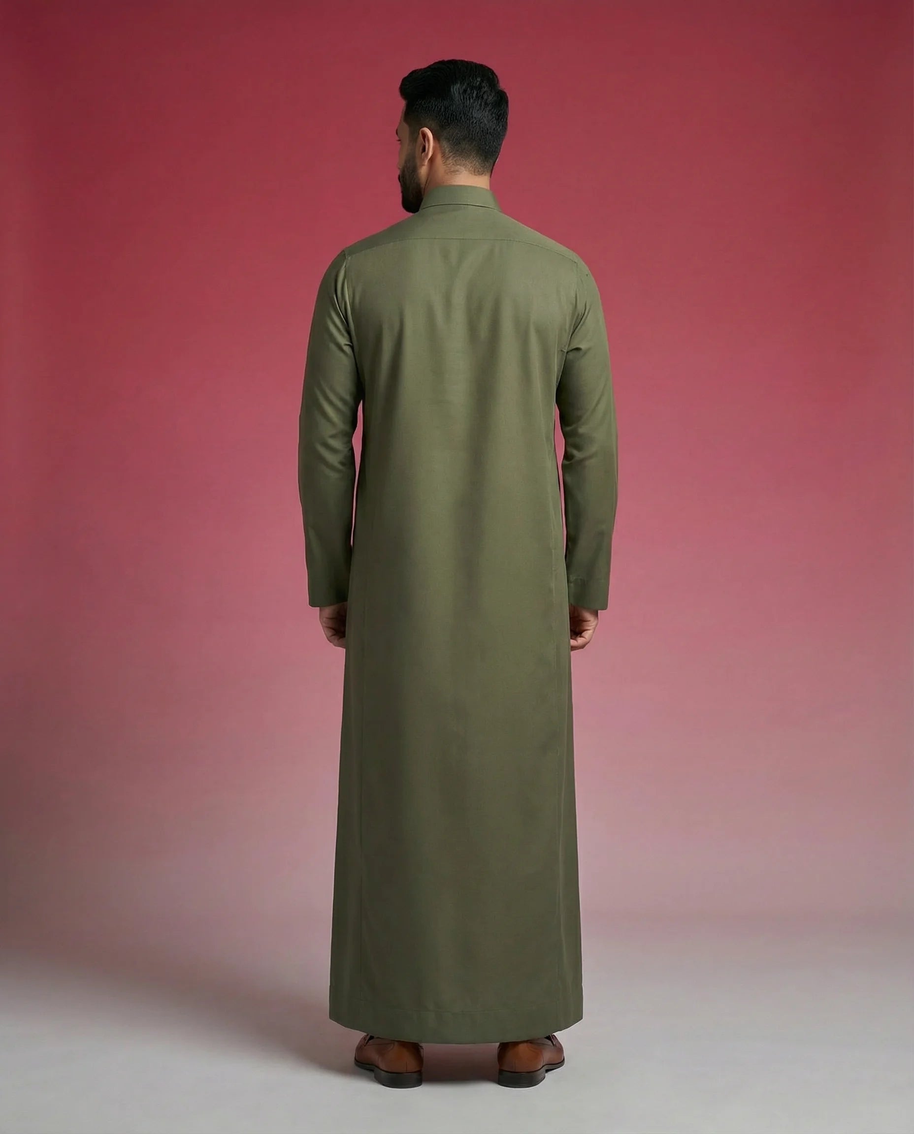 Back view of Olive Green Premium Thobe highlighting clean tailoring, premium construction, elegant drape, and refined Saudi-inspired craftsmanship. Luxury men's thobe, Saudi jubba, Arabic menswear, ثوب سعودي أنيق, ثوب رجالي فاخر, ثوب أخضر زيتوني, ثوب كلاسيكي رجالي, جلابية رجالية مودرن, دشداشة رجالية أنيقة, premium Islamic clothing for work, prayer, Ramadan, Eid, and formal occasions.