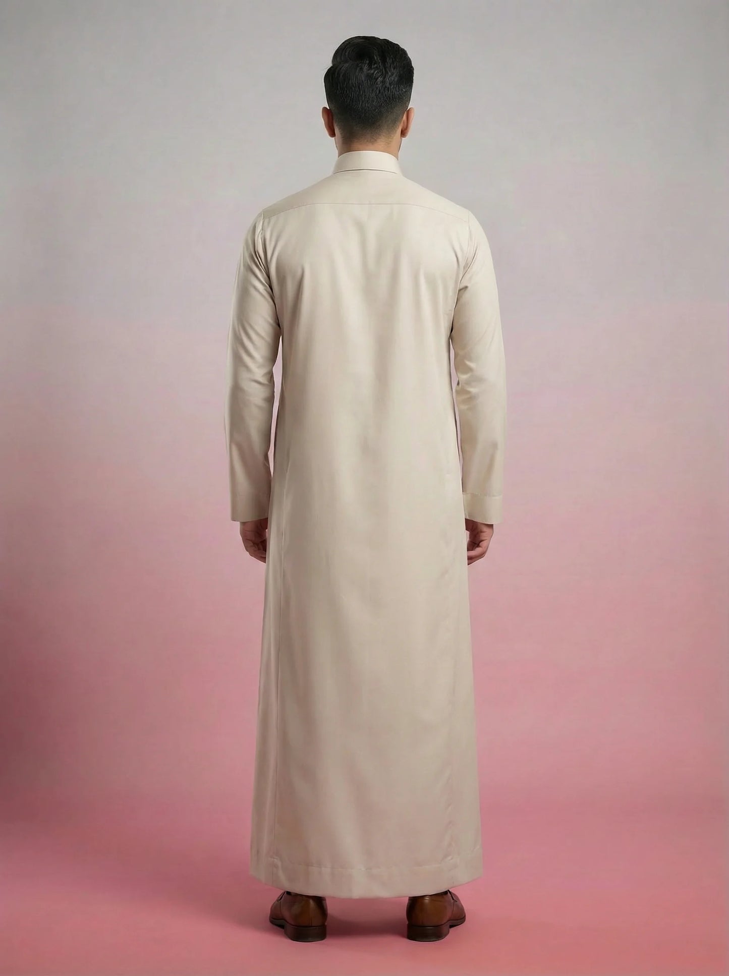 Back view of Pearl Beige Classic Thobe highlighting clean tailoring, premium construction, elegant drape, and refined Saudi-inspired craftsmanship. Luxury men's thobe, Saudi jubba, Arabic menswear, ثوب سعودي أنيق, ثوب رجالي فاخر, ثوب بيج لؤلؤي, ثوب كلاسيكي رجالي, جلابية رجالية مودرن, دشداشة رجالية أنيقة, premium Islamic clothing for work, prayer, Ramadan, Eid, and formal occasions.