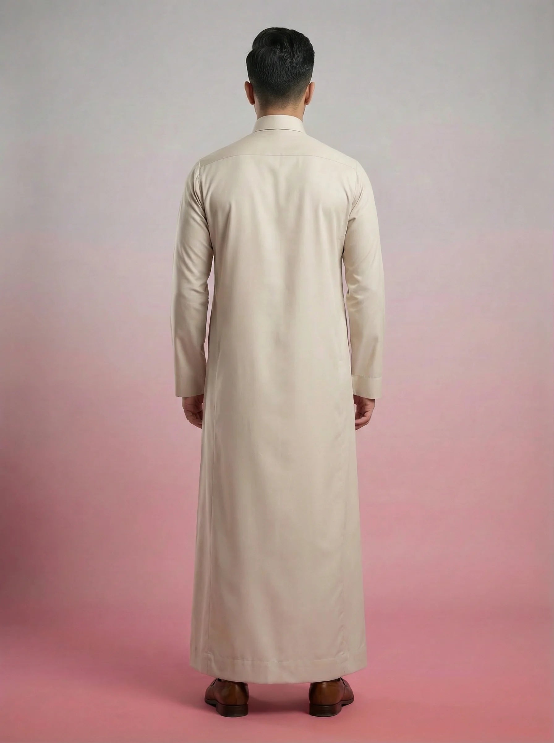 Back view of Pearl Beige Classic Thobe highlighting clean tailoring, premium construction, elegant drape, and refined Saudi-inspired craftsmanship. Luxury men's thobe, Saudi jubba, Arabic menswear, ثوب سعودي أنيق, ثوب رجالي فاخر, ثوب بيج لؤلؤي, ثوب كلاسيكي رجالي, جلابية رجالية مودرن, دشداشة رجالية أنيقة, premium Islamic clothing for work, prayer, Ramadan, Eid, and formal occasions.