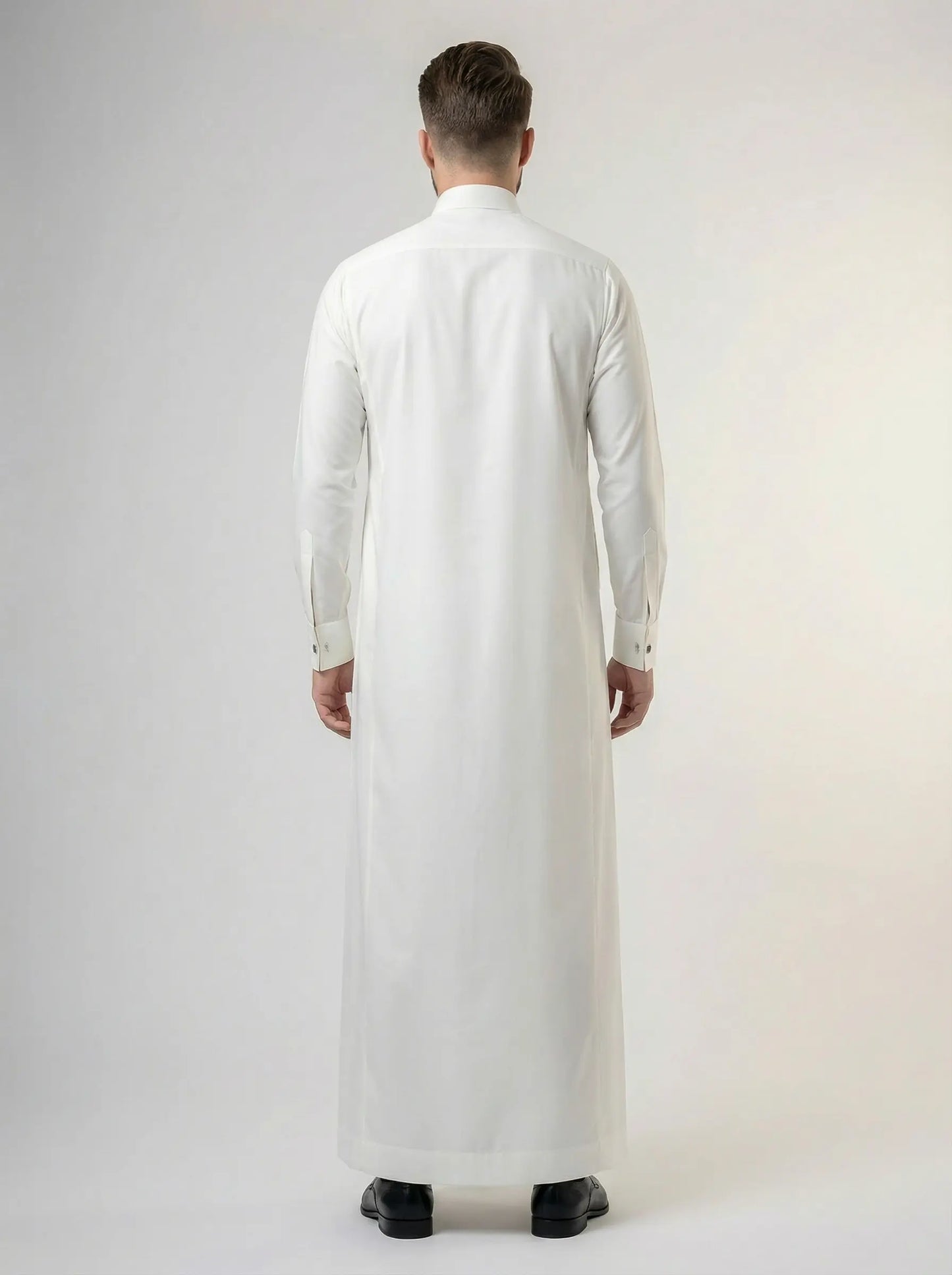 Back view of Pearl White Premium Formal Thobe featuring a clean tailored silhouette, premium construction, elegant drape, and luxury formal wear design for men.