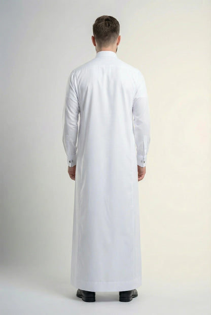 Back view of Pure White Premium Thobe highlighting a clean tailored silhouette, premium fabric drape, refined craftsmanship, and timeless formal menswear design. منظر خلفي لثوب أبيض فاخر يظهر القصة الأنيقة والانسيابية المثالية والتفصيل الاحترافي لمظهر راقٍ ومتوازن.