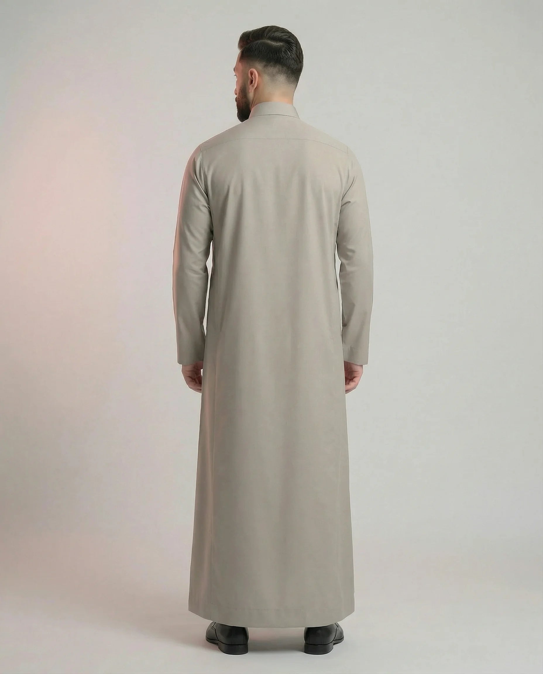 Back View of Sand Grey Saudi Thobe for Men Showcasing Clean Tailored Silhouette and Refined Traditional Design