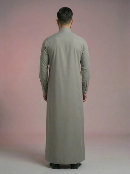 Back view of Urban Stone Grey Classic Thobe for men highlighting clean tailoring, balanced drape, streamlined construction, and full-length modest silhouette. Sophisticated Saudi-inspired Islamic attire crafted for a polished appearance and unrestricted everyday comfort.