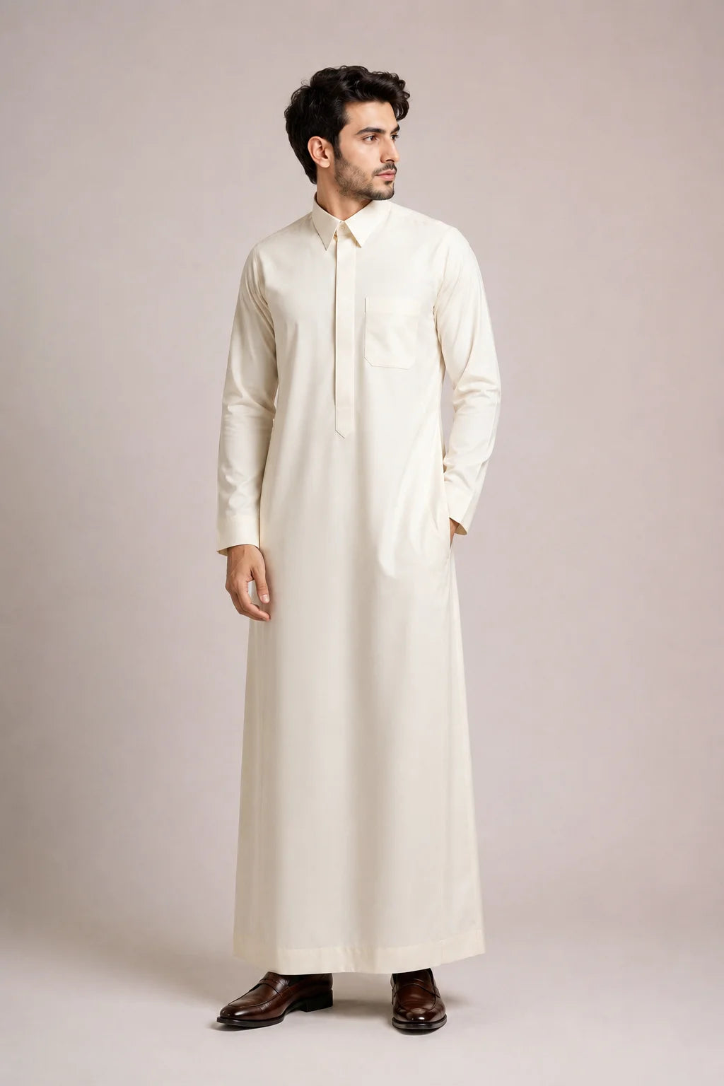 Side profile of Cream White Signature men's thobe featuring a structured turn down collar, premium fabric and refined everyday elegance