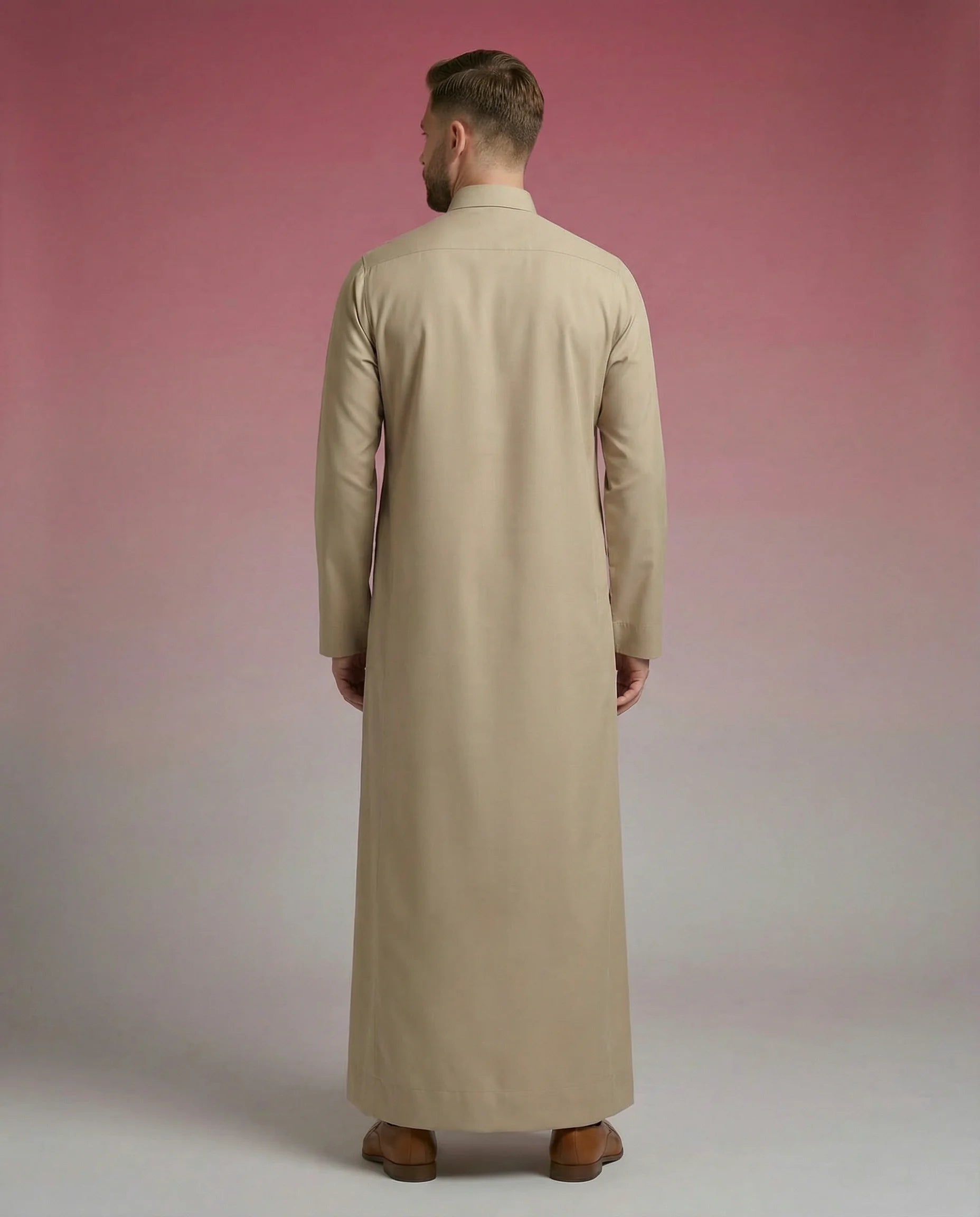 Desert Beige Classic Thobe Timeless Warm Elegance featuring premium tailoring, concealed front placket, refined shirt collar, and breathable luxury fabric. Luxury Saudi thobe, men's Islamic clothing, premium jubba, ثوب سعودي رجالي, ثوب بيج فاخر, ثوب رسمي للرجال, جلابية رجالية كلاسيكية, دشداشة رجالية حديثة, elegant modest fashion suitable for Jummah prayer, work environments, Eid celebrations, Ramadan gatherings, and everyday sophistication.
