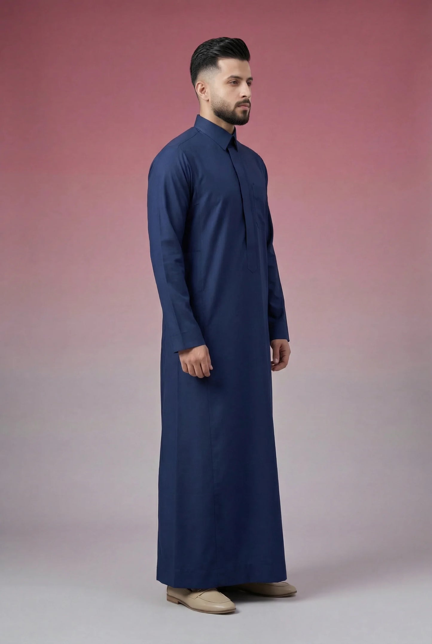Side profile of Navy Blue Classic Thobe displaying modern tailoring, streamlined silhouette, structured collar, and lightweight breathable fabric. Luxury men's thobe, Saudi jubba, Arabic clothing, ثوب سعودي أنيق, ثوب رجالي فاخر, ثوب أزرق بحري, ثوب كحلي رجالي, دشداشة رجالية رسمية, جلابية رجالية مودرن, premium Islamic menswear crafted for office wear, Ramadan gatherings, Eid celebrations, and sophisticated daily use.