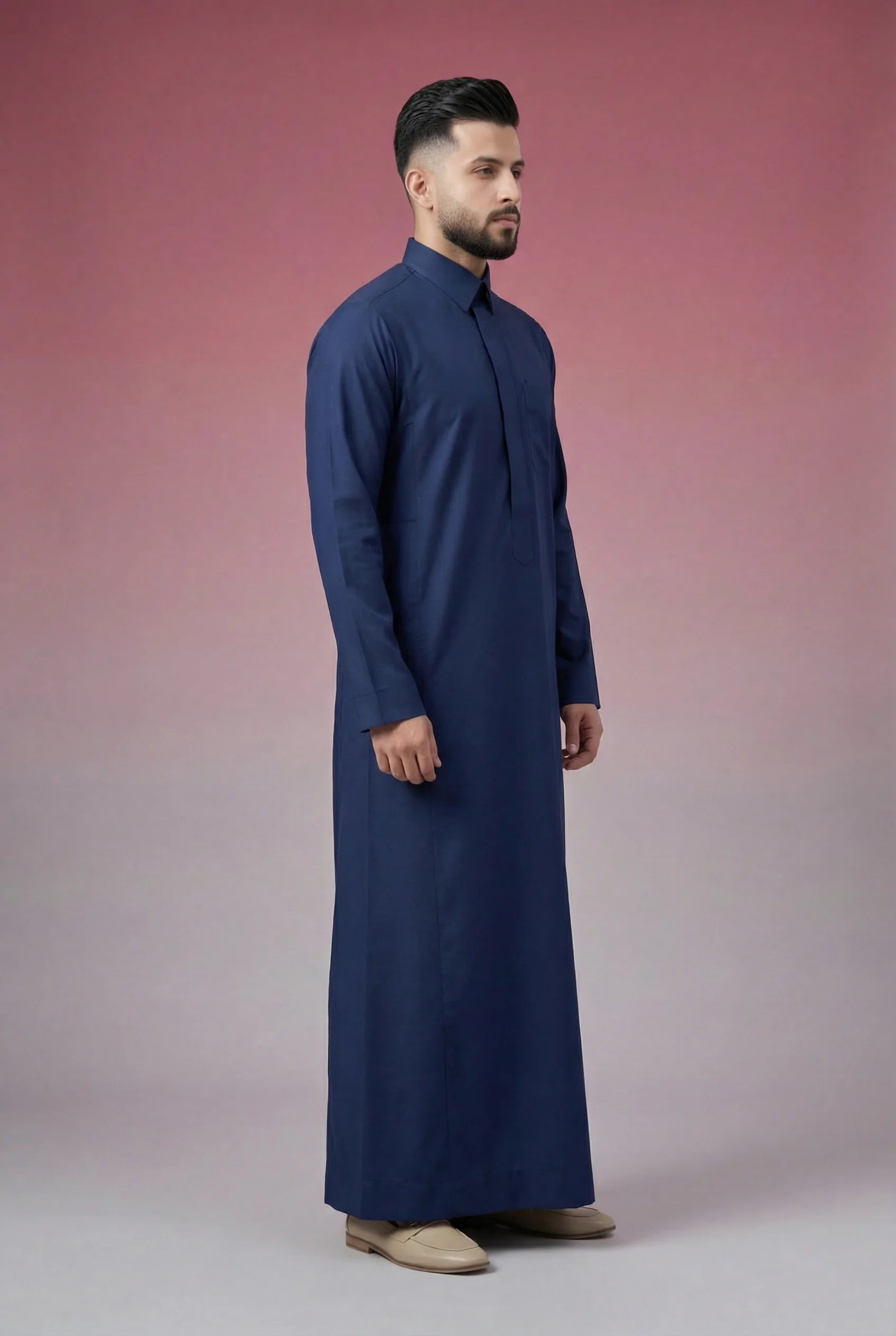 Side profile of Navy Blue Classic Thobe displaying modern tailoring, streamlined silhouette, structured collar, and lightweight breathable fabric. Luxury men's thobe, Saudi jubba, Arabic clothing, ثوب سعودي أنيق, ثوب رجالي فاخر, ثوب أزرق بحري, ثوب كحلي رجالي, دشداشة رجالية رسمية, جلابية رجالية مودرن, premium Islamic menswear crafted for office wear, Ramadan gatherings, Eid celebrations, and sophisticated daily use.