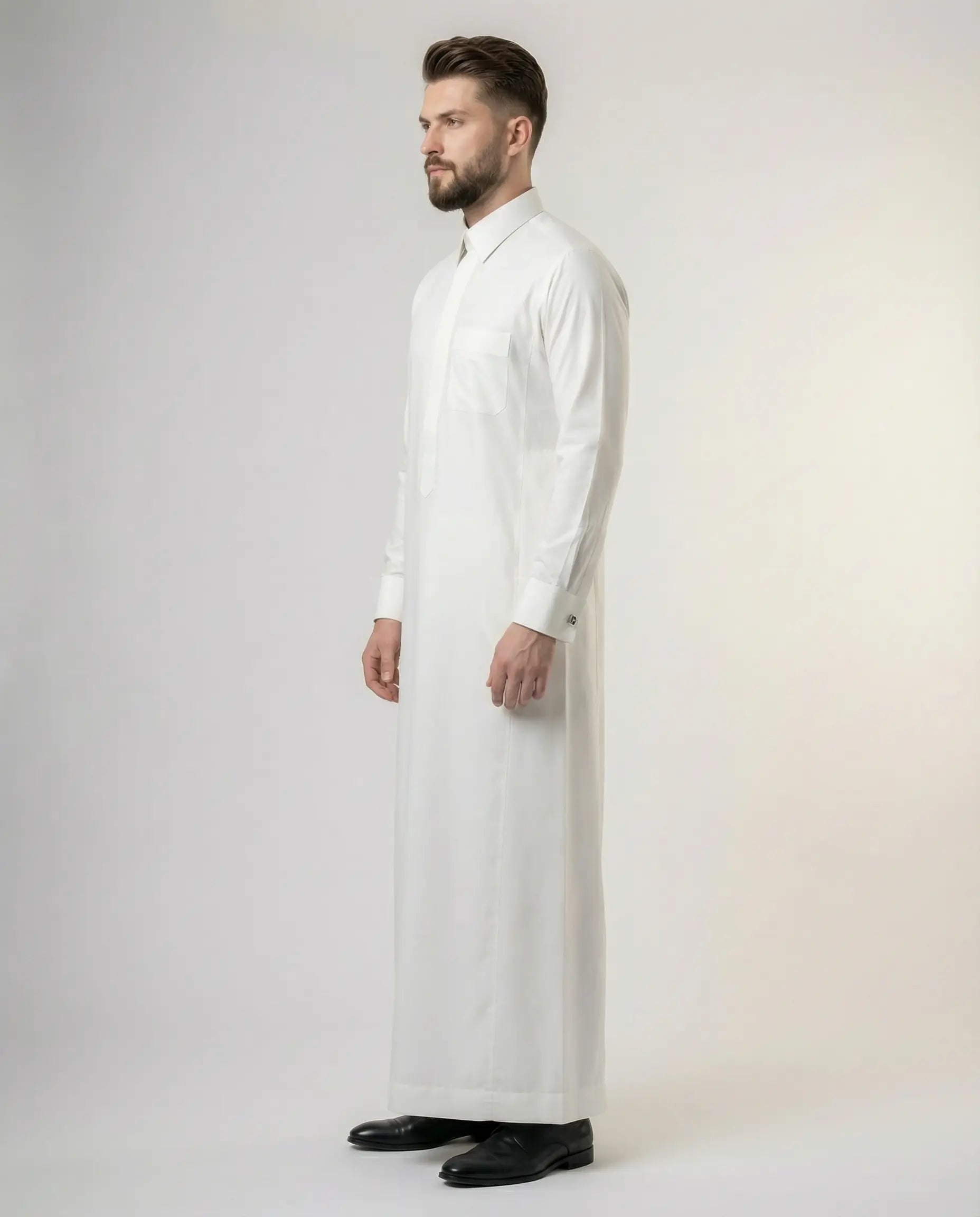 Side profile of Pearl White Premium Formal Thobe highlighting executive tailoring, structured fit, luxury fabric, formal collar, and sophisticated menswear styling.