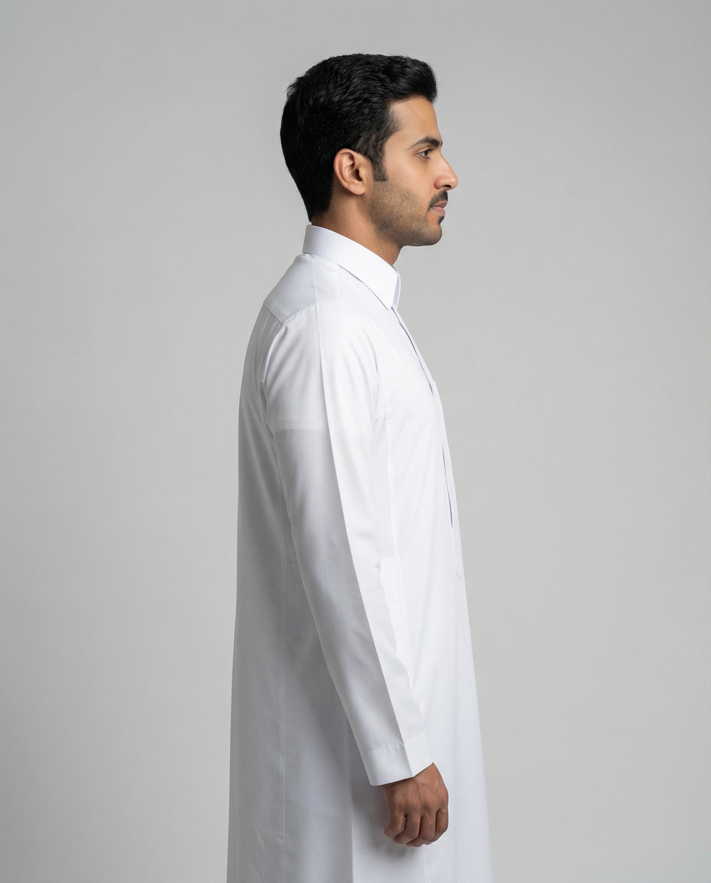 Side profile of Haybah Pure White Classic thobe with turn down collar, modern tailored fit and premium white fabric construction