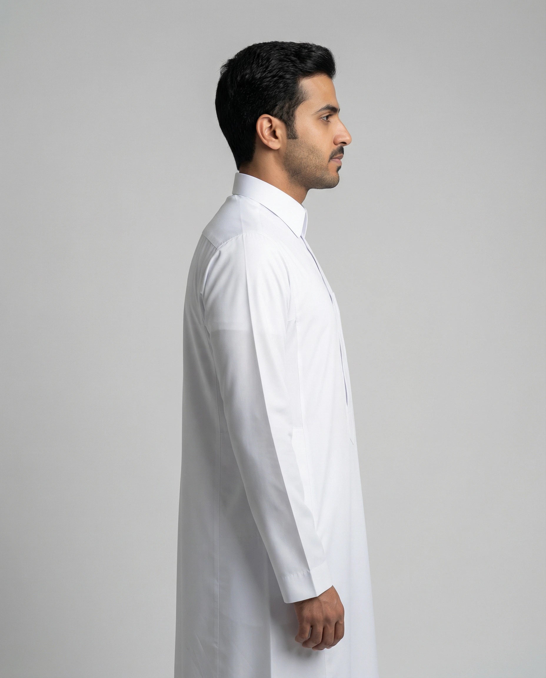 Side profile of Haybah Pure White Classic thobe with turn down collar, modern tailored fit and premium white fabric construction