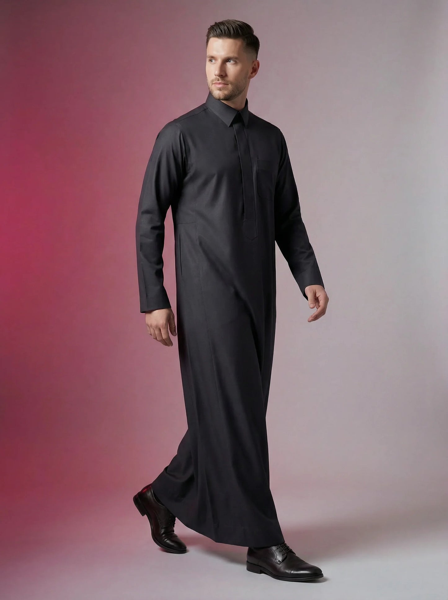 Carbon Black Executive Thobe in a confident walking pose featuring a sleek silhouette, premium fabric, concealed placket, and refined Saudi tailoring. Luxury carbon black thobe, executive jubba, Saudi menswear, ثوب كربوني أسود رسمي, ثوب سعودي فاخر, ثوب رجالي أنيق, جلابية رجالية فخمة, دشداشة رجالية راقية, premium Islamic clothing for Eid, Ramadan, Friday prayer, business meetings, and special occasions.